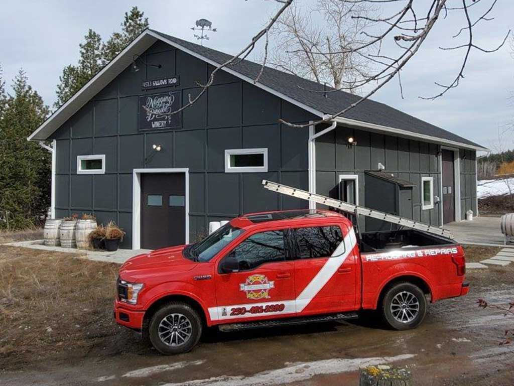 TI Roof red truck in front of Nagging Doubt Winery roofing project